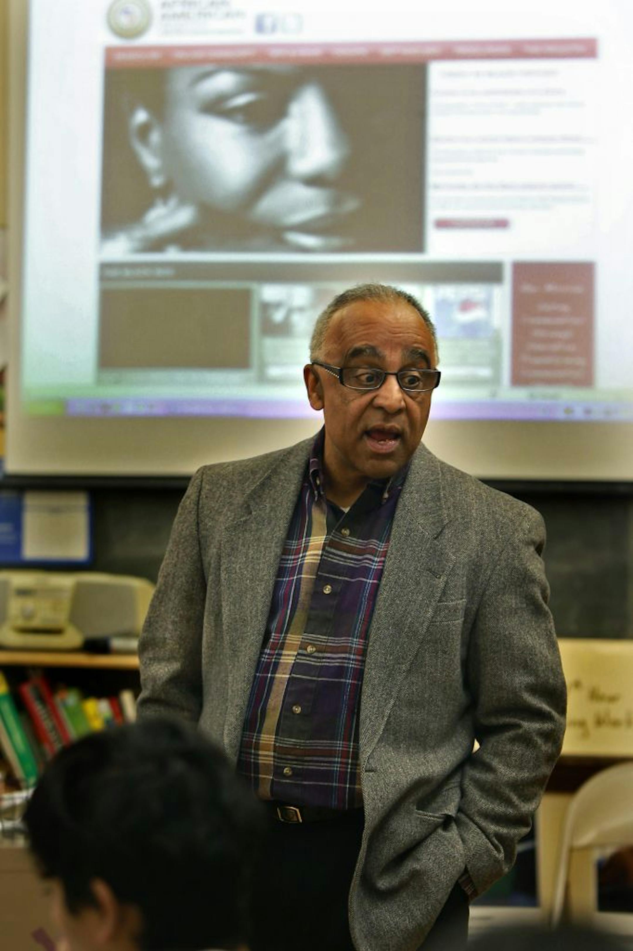 Benjamin Mchie talked to students during a presentation to a Patrick Henry High School 9th-grade class as part of National African American Parent Involvement Day, Monday, February 13, 2012. Michie calls the African American Registry �more of a calling than a career.� The 62-year-old Minneapolitan has spent thousands of hours updating the website, with history and videos. A profile of the man and his quest.(ELIZABETH FLORES/STAR TRIBUNE) ELIZABETH FLORES � eflores@startribune.com