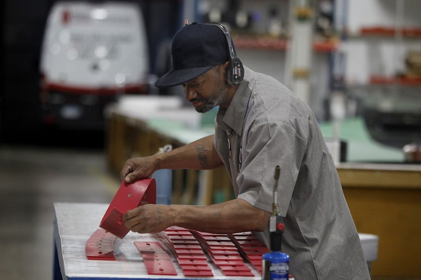 Midwest Rubber Service & Supply employee Kelvin Adams worked on making Linatex rubber squeegee, which are used in large floor cleaning machines, Wednesday, October 31, 2012 in Plymouth, MN. The company was the victim of trademark infringers who knocked off its very durable squeegee rubber products with cheap fakes. As a result, roughly 50 percent of the family owned business was impacted. Small company is now fighting back with attorneys around the world and design improvements that thwart count