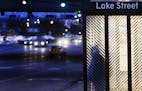 A commuter waits in a bus shelter at the Lake Street/Midtown Metro Station Friday, March 28, 2014, in Minneapolis, MN.