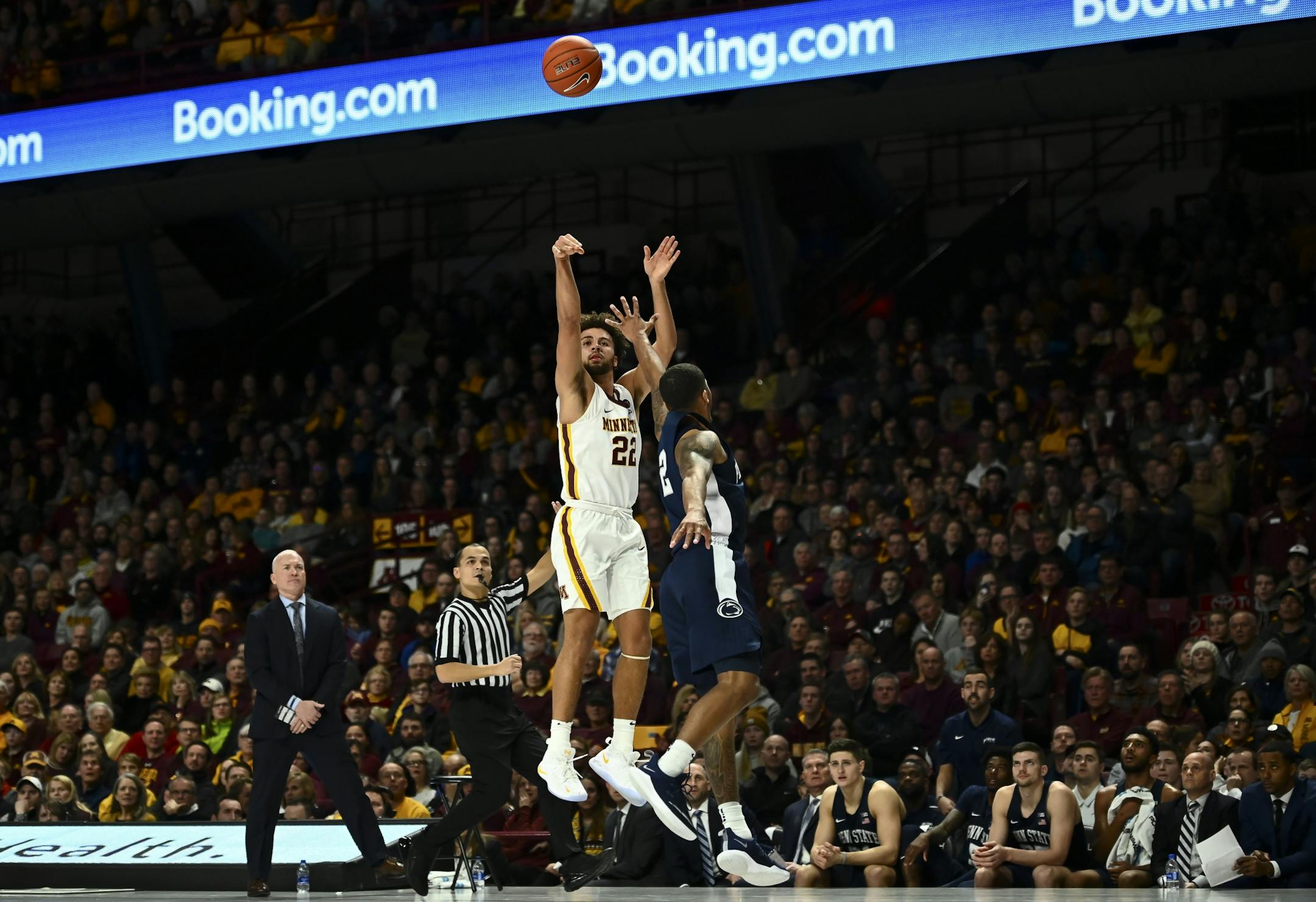 Minnesota Golden Gophers guard Gabe Kalscheur (22) hit a 3-pointer against the defense of Penn State Nittany Lions guard Myles Dread (2) in the first half.