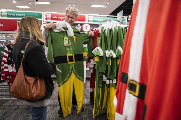 Paul Hokeness of Minneapolis shopped for festive pajamas with his wife Peg for a family Christmas pajama party they host every year.