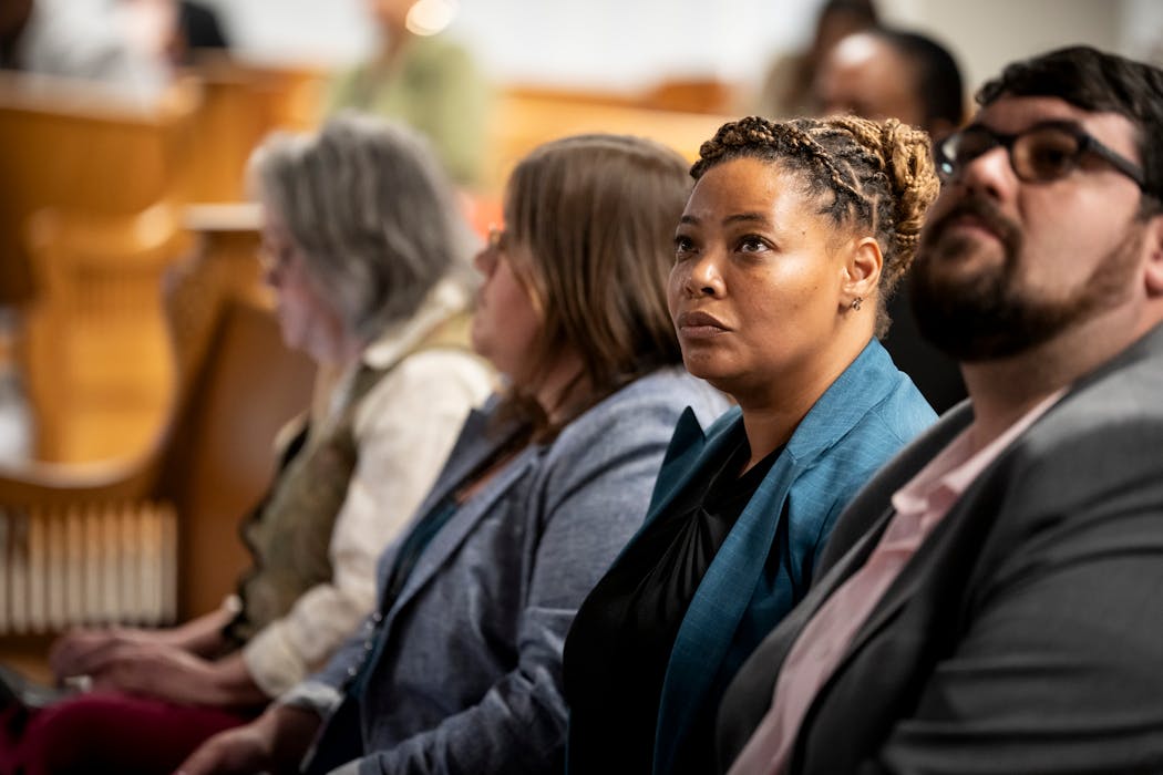 New civil rights director Michelle Phillips listens to public comments during a Minneapolis City Council public hearing at the Public Service Center in Minneapolis on Wednesday.