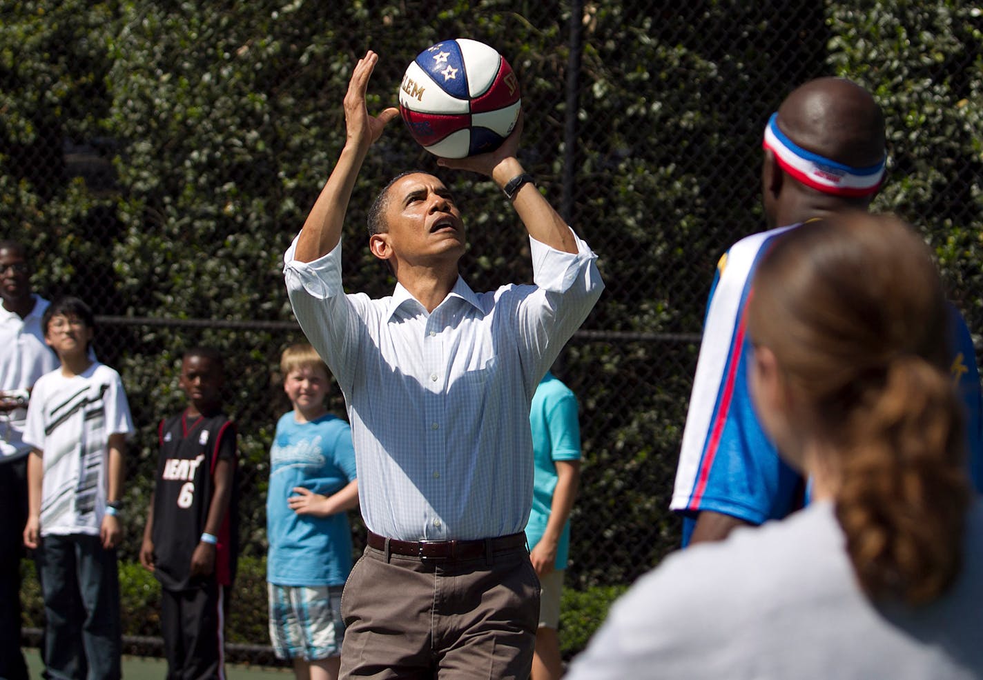 President Barack Obama plays basketball during the 2011 White House Easter Egg Roll at the White House in Washington.