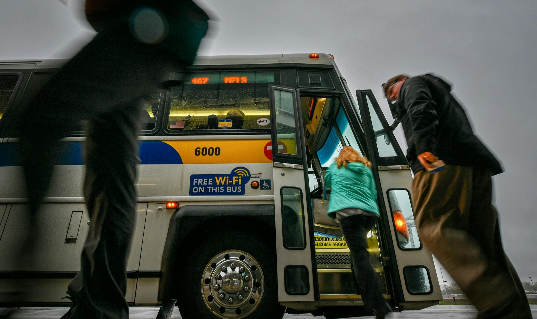 Members of the Minneapolis and St. Paul chambers of commerce offered leaflets to morning commuters at Kenrick Avenue Park-n-Ride in Lakeville, urging them to call their legislators about a proposed 40 percent reduction in transit funding.