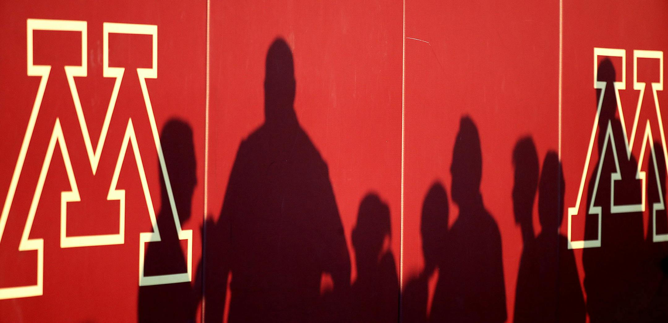 Shadows of fans on a wall at TCF Bank Stadium last Sept. 1, when the Gophers football team began its season, and hours before an alleged sexual assault that has hung over the university.