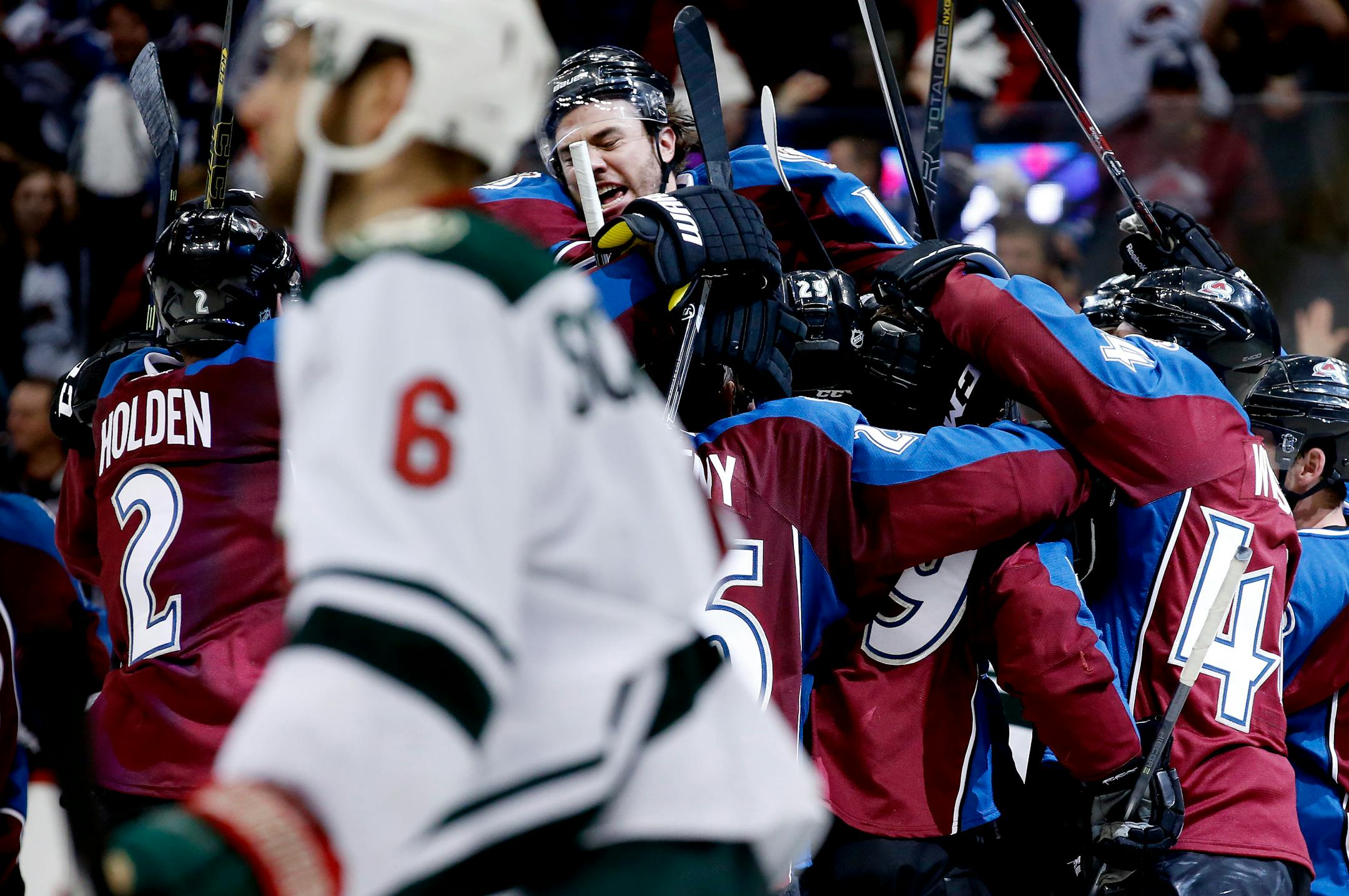 Colorado players celebrated after a game-winning goal in overtime by Nathan McKinnon