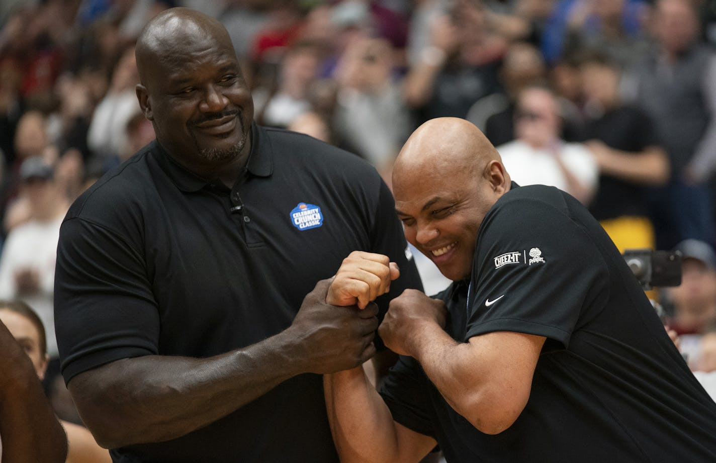 Team Cheeze-It coach Shqquille O'Neal, left, and Team Pringles coach Charles Barkley goofed off during introductions before the game. ] JEFF WHEELER &#x2022; jeff.wheeler@startribune.com The Celebrity Crunch Classic was held in Schoenecker Arena on the University of St. Thomas campus in St. Paul Sunday afternoon, April 7, 2019. Vikings tight end Kyle Rudolph was able to show off his considerable basketball skills for his Team Pringles coach, Charles Barkely. Team Pringles prevailed 69-66.