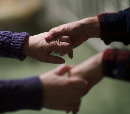 Elizabeth Wolf, right, leads her mother Nancy Brood to bed, at their home in Haddonfield, N.J., Jan 5, 2016. In 2010 Wolf, along with her husband, moved back into her childhood home to help her parents, who both suffer from dementia, expecting to arrange caregiving help and then return home to Vermont: Over five years later, she is still caring for them. (Mark Makela/The New York Times) -- -- NO SALES --