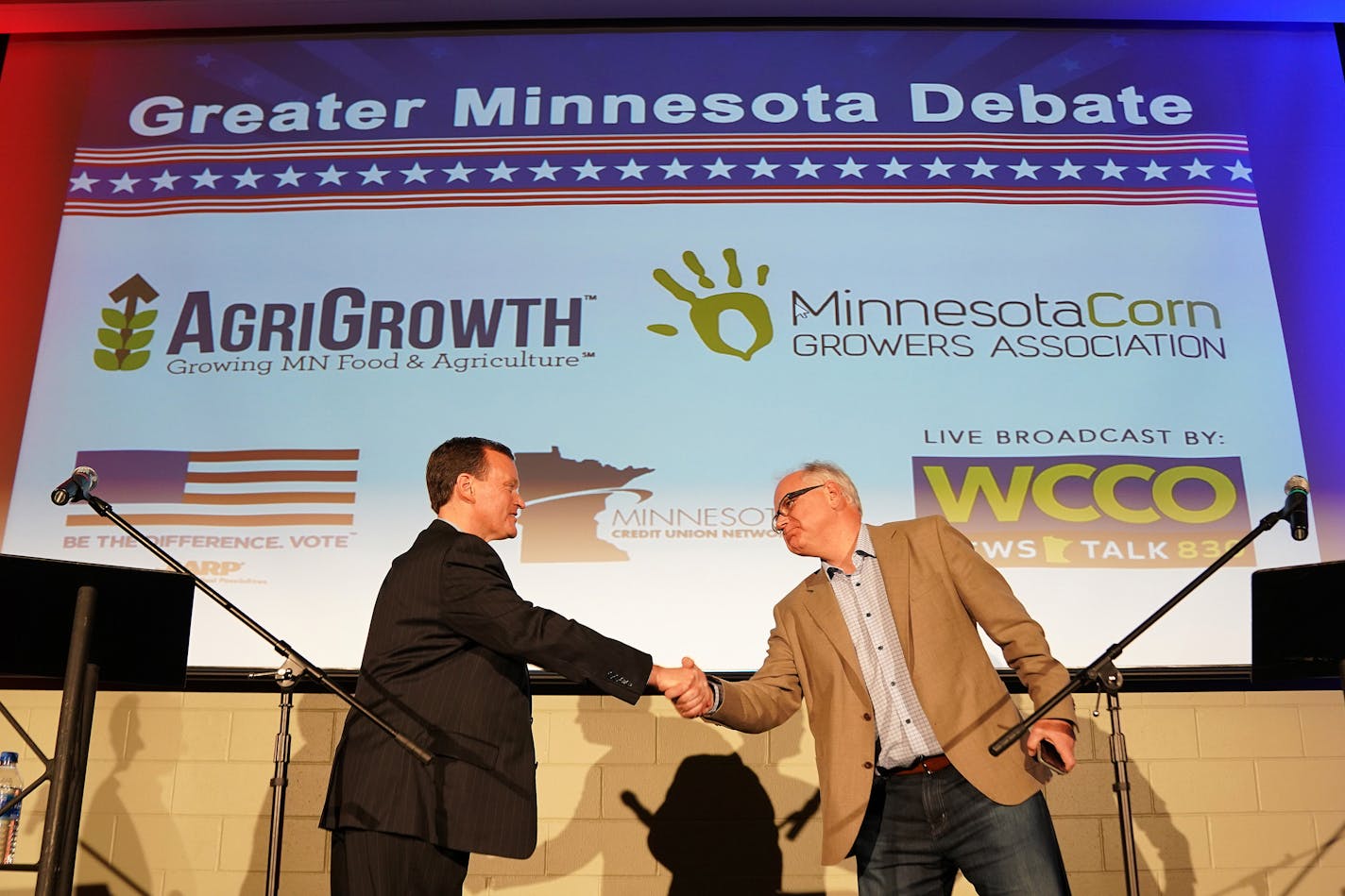 Minnesota gubernatorial candidate Hennepin County Commissioner Jeff Johnson, Republican, left, shakes hands with Congressman Tim Walz, DFL, after they participated in the "Greater Minnesota Debate" in Willmar, Minn., on Tuesday, Oct. 9, 2018.