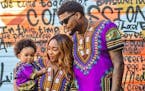 Rapper Jon Mitchell-Momoh, with his late partner, Monique Baugh, and one of their two daughters, 3-year-old Legend.