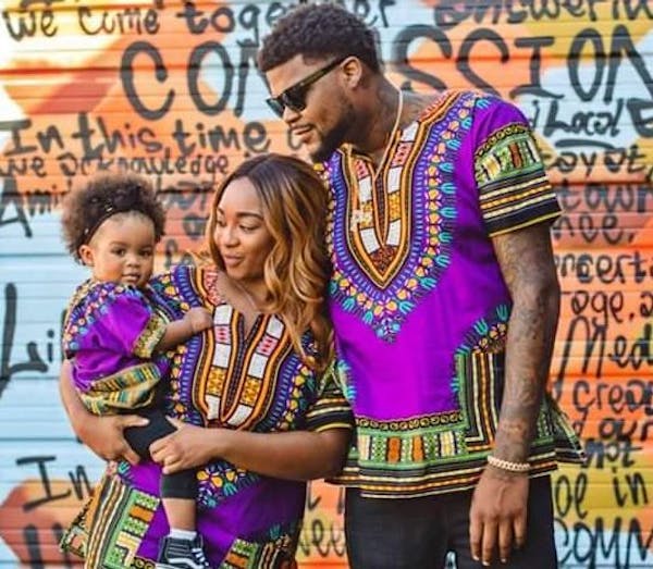 Rapper Jon Mitchell-Momoh, with his late partner, Monique Baugh, and one of their two daughters, 3-year-old Legend.
