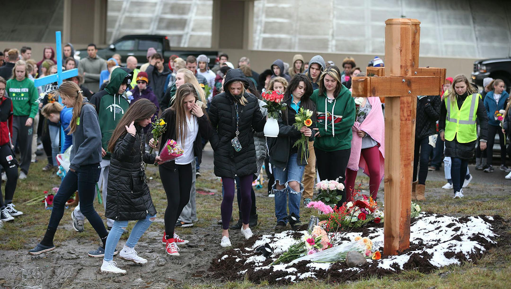 Students from Mounds View High school gathered at the crash scene along Hwy. 96 where they left memorials for two students who were killed in a crash December 05, 2016.