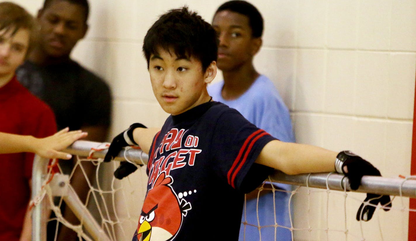 Members of the Robbinsdale/Hopkins/Mound/Westonka physically impaired soccer team during practice Wednesday, Nov. 18, 2015, at Robbinsdale Armstrong High in Plymouth, MN. Here, goalie Vincent Luu relaxes between drills during practice.](DAVID JOLES/STARTRIBUNE)djoles@startribune.com Robbinsdale/Hopkins/Mound/Westonka physically impaired soccer team is among the favorites to win the state tournament. ** goalie Vincent Luu,cq