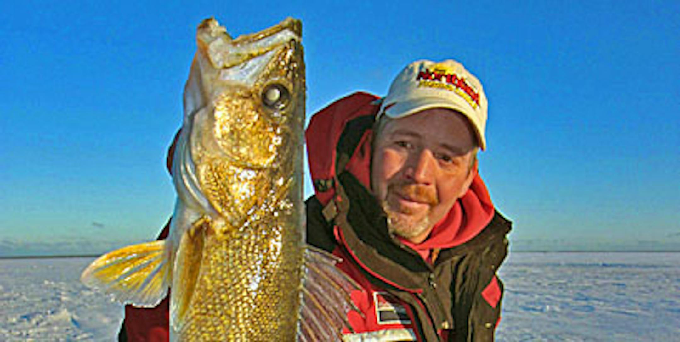 Tim Schwartz of H2O Outfitters in Big Lake with a chunky Mille Lacs walleye he caught guiding with Roach's Guide Service