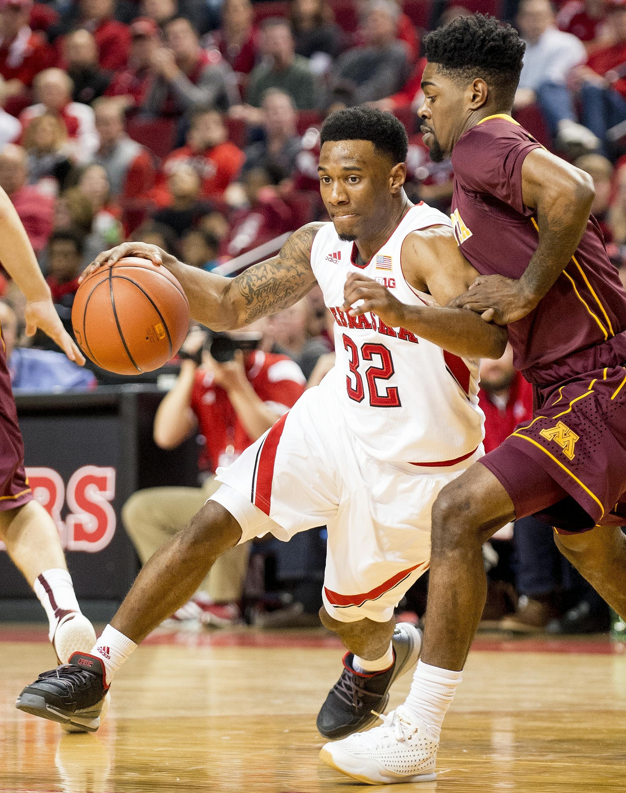 Nebraska guard Benny Parker (32) drives in to the lane against Minnesota guard Kevin Dorsey (4) during the second half of an NCAA college basketball game in Lincoln, Neb., Tuesday, Jan. 12, 2016. (Francis Gardler/The Journal-Star via AP) LOCAL TELEVISION OUT; KOLN-TV OUT; KGIN-TV OUT; KLKN-TV OUT; MANDATORY CREDIT