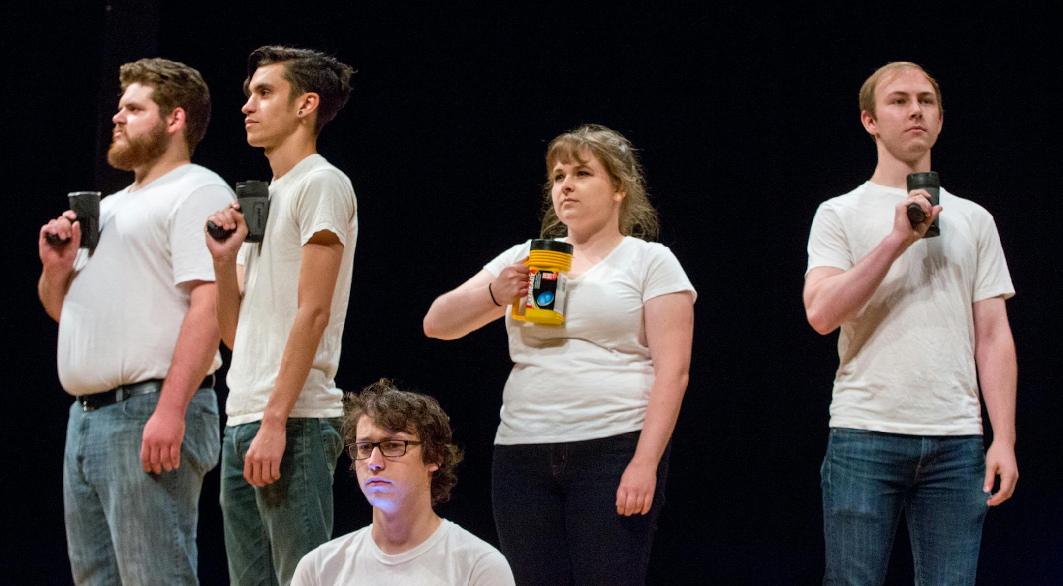 Chase Adelsman, A.J. Herman, Jacob Hooper, Erin Gassner and Riley Parham (from left to right) hold flashlights during their performance of “Slaughterhouse Five: A Musical” at the Minnesota Fringe Festival first preview night. Monday July 17, 2017, Minnesota Fringe Festival executive director Dawn Bentley; Fringe Previews #1; 30 three minute show previews; University of Minnesota Rarig Center Thrust stage; Minneapolis