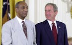 FILE - In this July 9, 2002 file photo, President Bush, right, stands with comedian Bill Cosby during the announcement of Cosby's Presidential Medal o