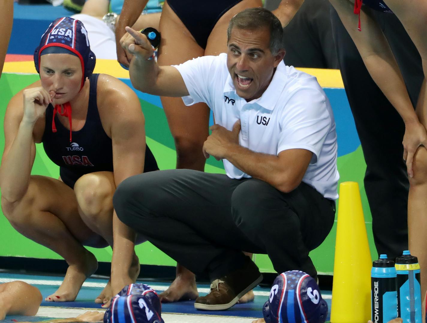 The U.S. women's water polo team secured a semifinal berth with a 13-3 victory over Brazil Monday afternoon at the Olympic Aquatics Stadium. Here, Coach Adam Kerkorian worked with his team during a time out. ] 2016 Summer Olympic Games - Rio Brazil brian.peterson@startribune.com Rio de Janeiro, Brazil - 08/15/2016