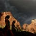 Hikers look up at a fast moving storm as it makes its way through Zion National Park outside of Springdale, Utah.