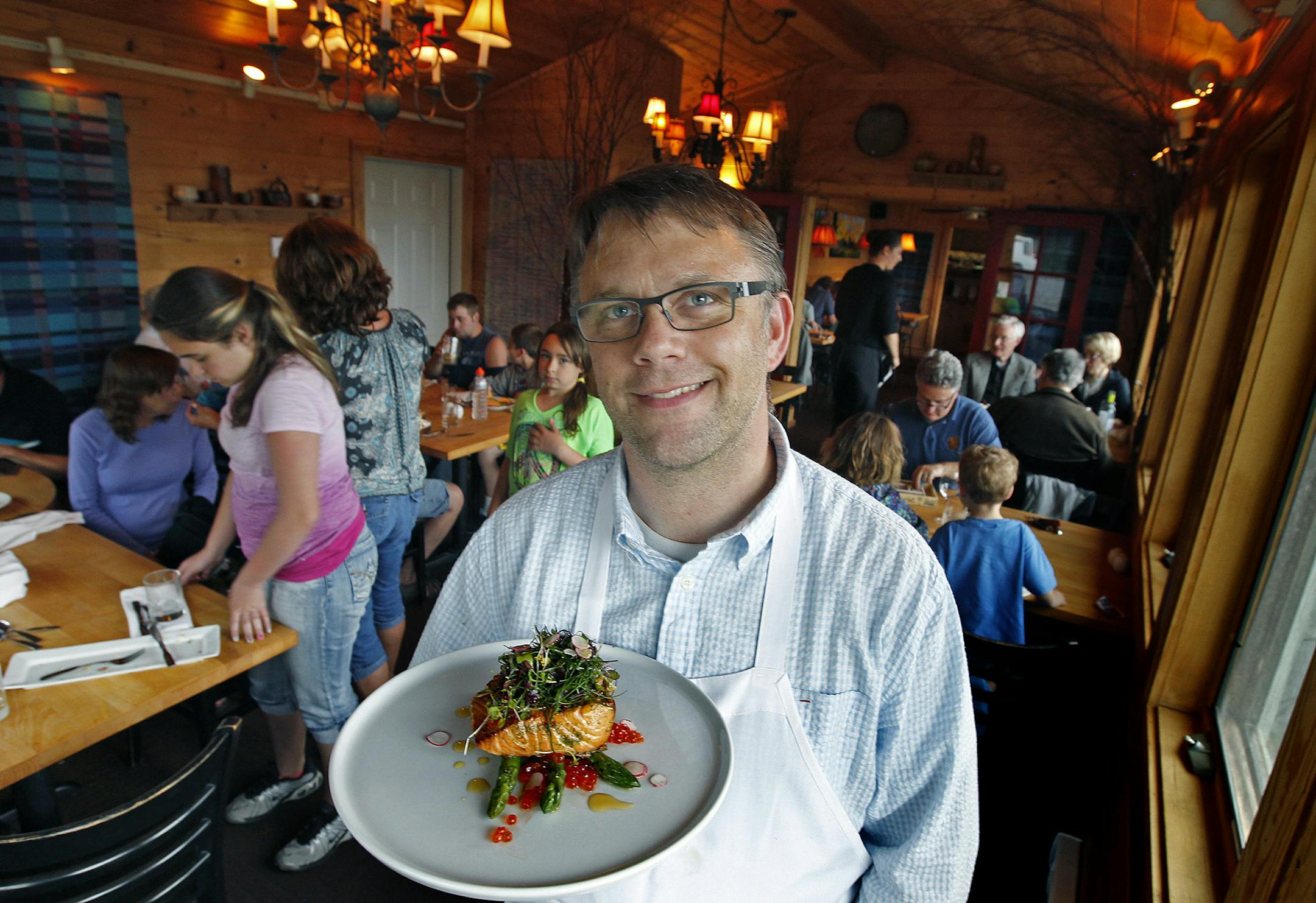 New Scenic Cafe chef Scott Gradin with one of the featured menu items, Thursday, June 20, 2013 in Duluth, MN. (ELIZABETH FLORES/STAR TRIBUNE) ELIZABETH FLORES • eflores@startribune.com