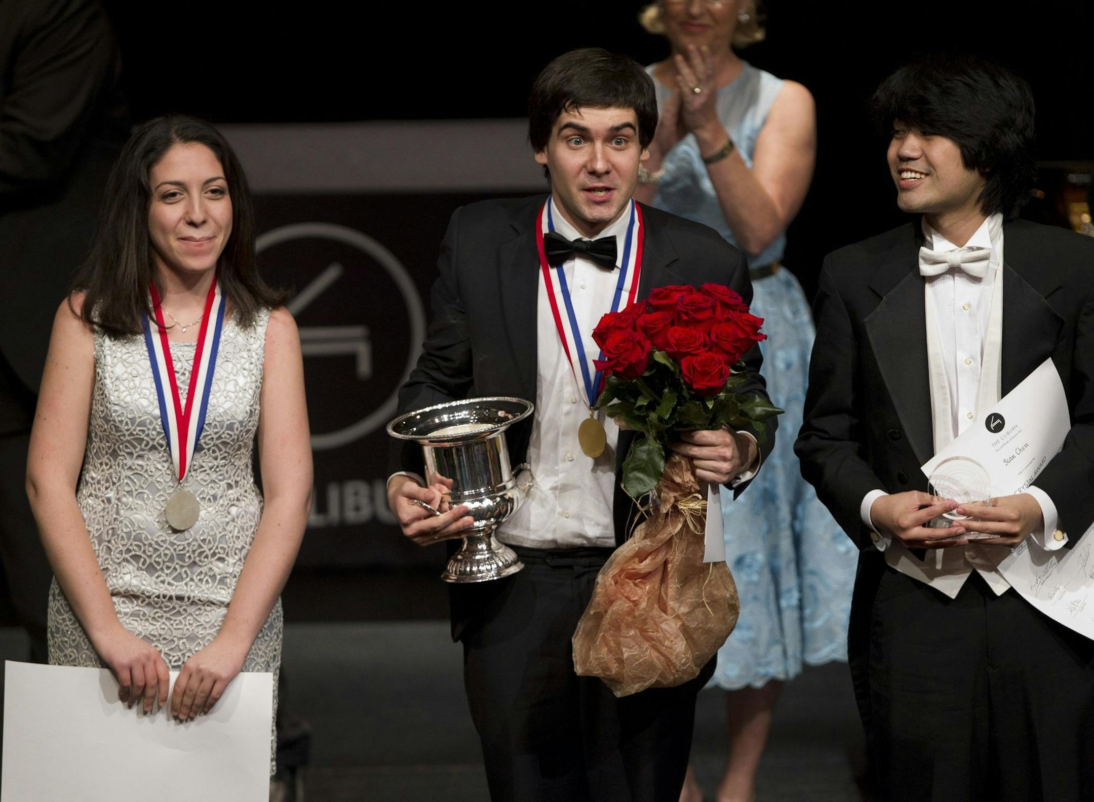 Cliburn medalists Beatrice Rana, 2nd place winner, Vadym Kholodenko, first place winner, and Sean Chen, third place winner, receive applause from the audience at the final awards ceremony at the 14th Van Cliburn International Piano Competition in Fort Worth, Texas, Sunday June 9, 2013. (Joyce Marshall/Fort Worth Star-Telegram/MCT)