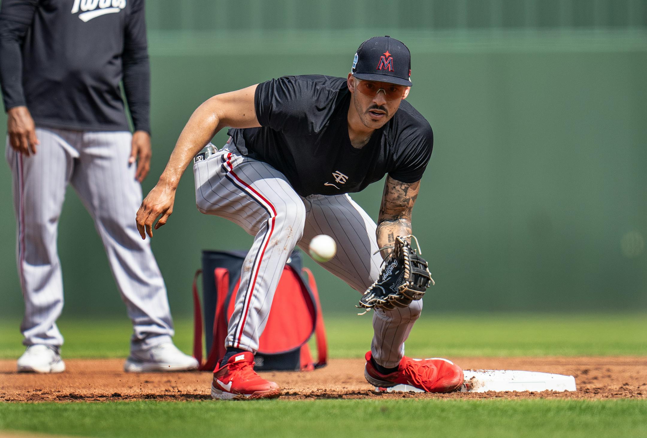 Minnesota Twins shortstop Carlos Correa fields a ball.