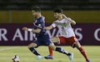Minnesota United is reportedly pursuing Luis Amarilla of Ecuador's Universidad Catolica, left, shown in a game last August in Quito. The 24-year-old s