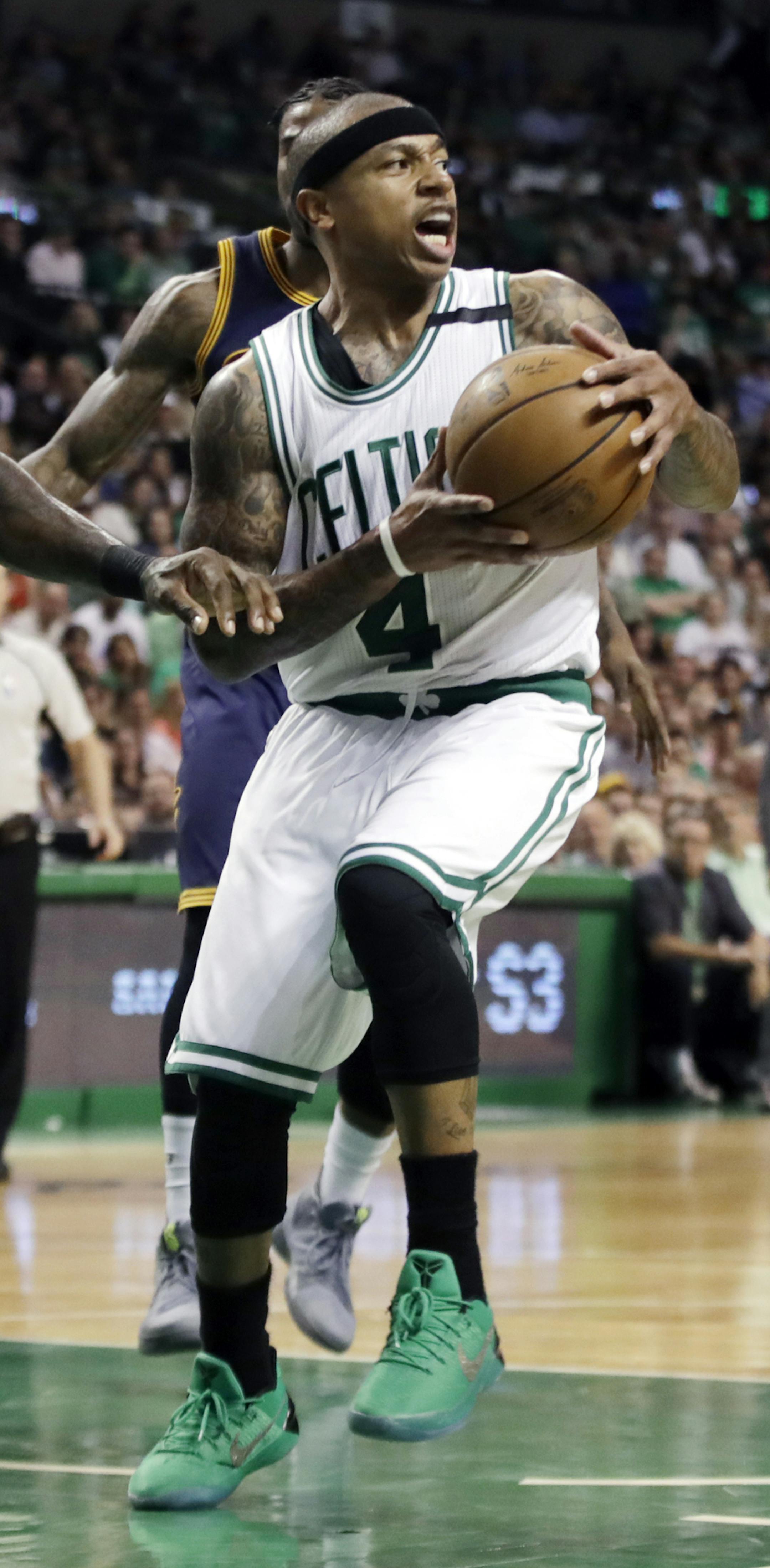 Boston Celtics guard Isaiah Thomas (4) looks to pass away from the defense of Cleveland Cavaliers forward LeBron James (23) during the second quarter of Game 2 of the NBA basketball Eastern Conference finals,, Friday, May 19, 2017, in Boston. (AP Photo/Elise Amendola)