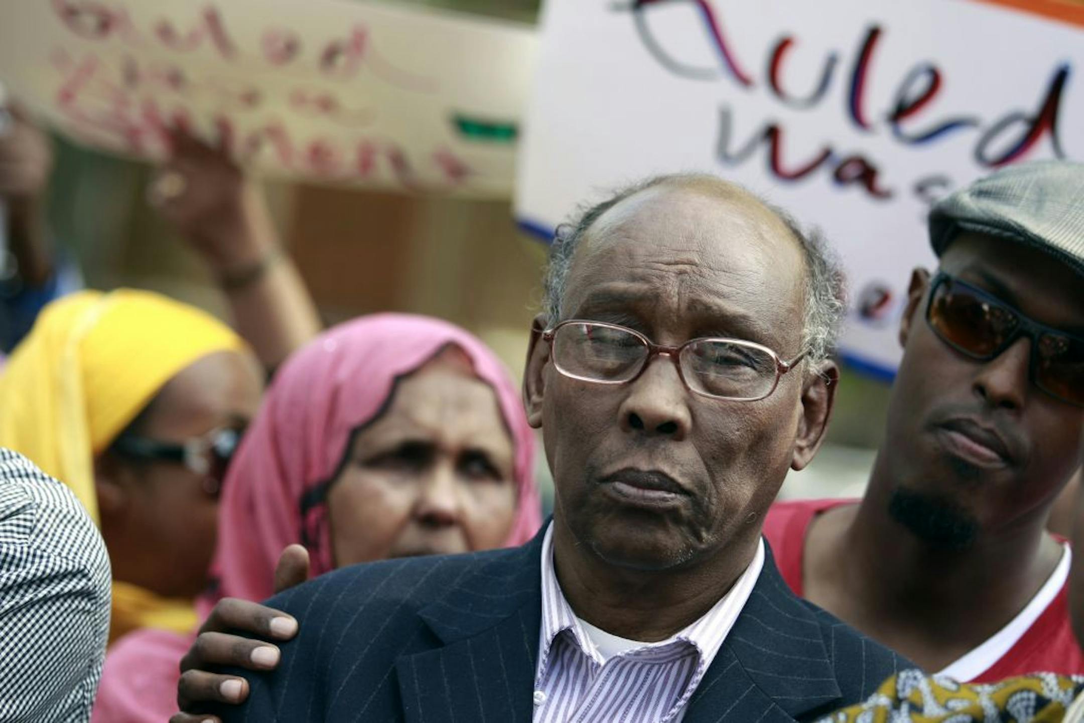 Family members and friends surrounded Hashi Mohamed as he spoke about son Guled Hashi Mohamed during a vigil on Wednesday afternoon.