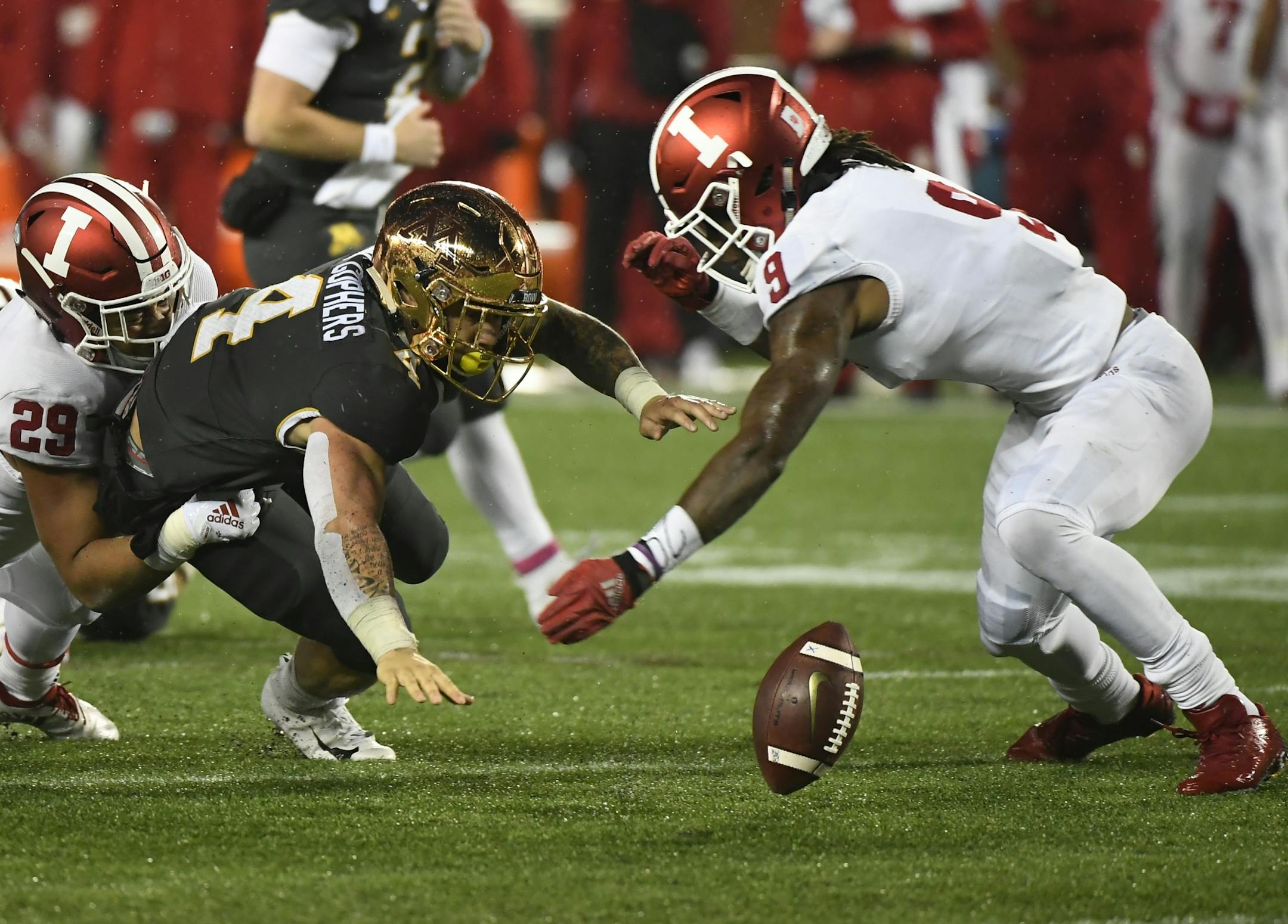 Minnesota Golden Gophers running back Shannon Brooks (4) fumbled the ball leading to a turnover in the second half while being tackled from behind by Indiana Hoosiers defensive back Khalil Bryant (29).