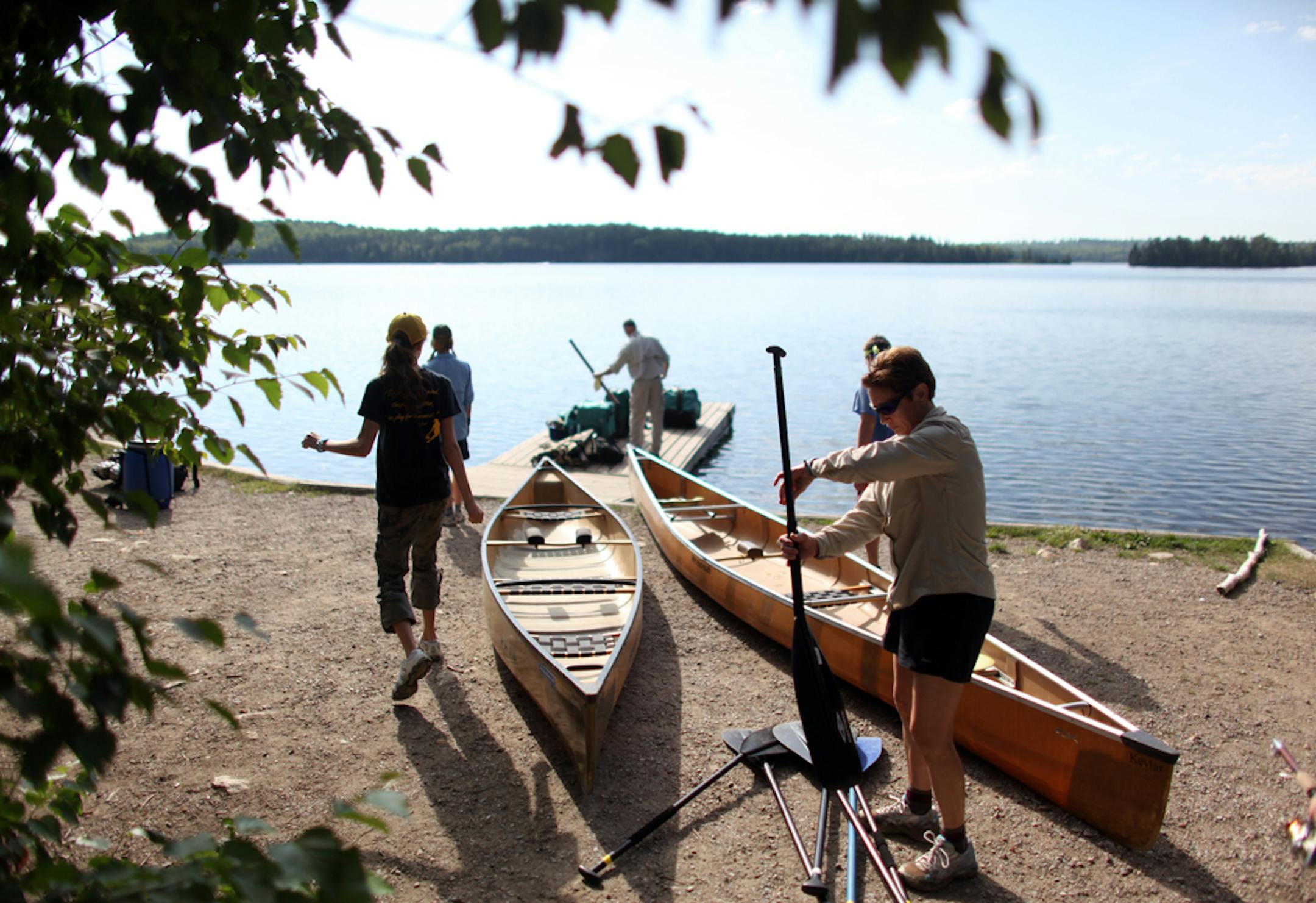 A group of friends enjoys prime paddling in the Boundary Waters Canoe Area.