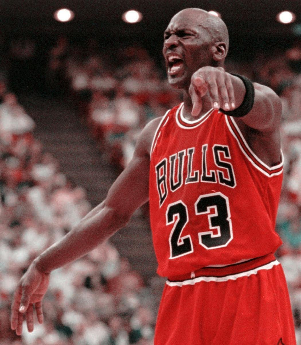 Michael Jordan, wearing his old jersey, gives direction from the court during NBA Eastern Conference semifinals play in Orlando