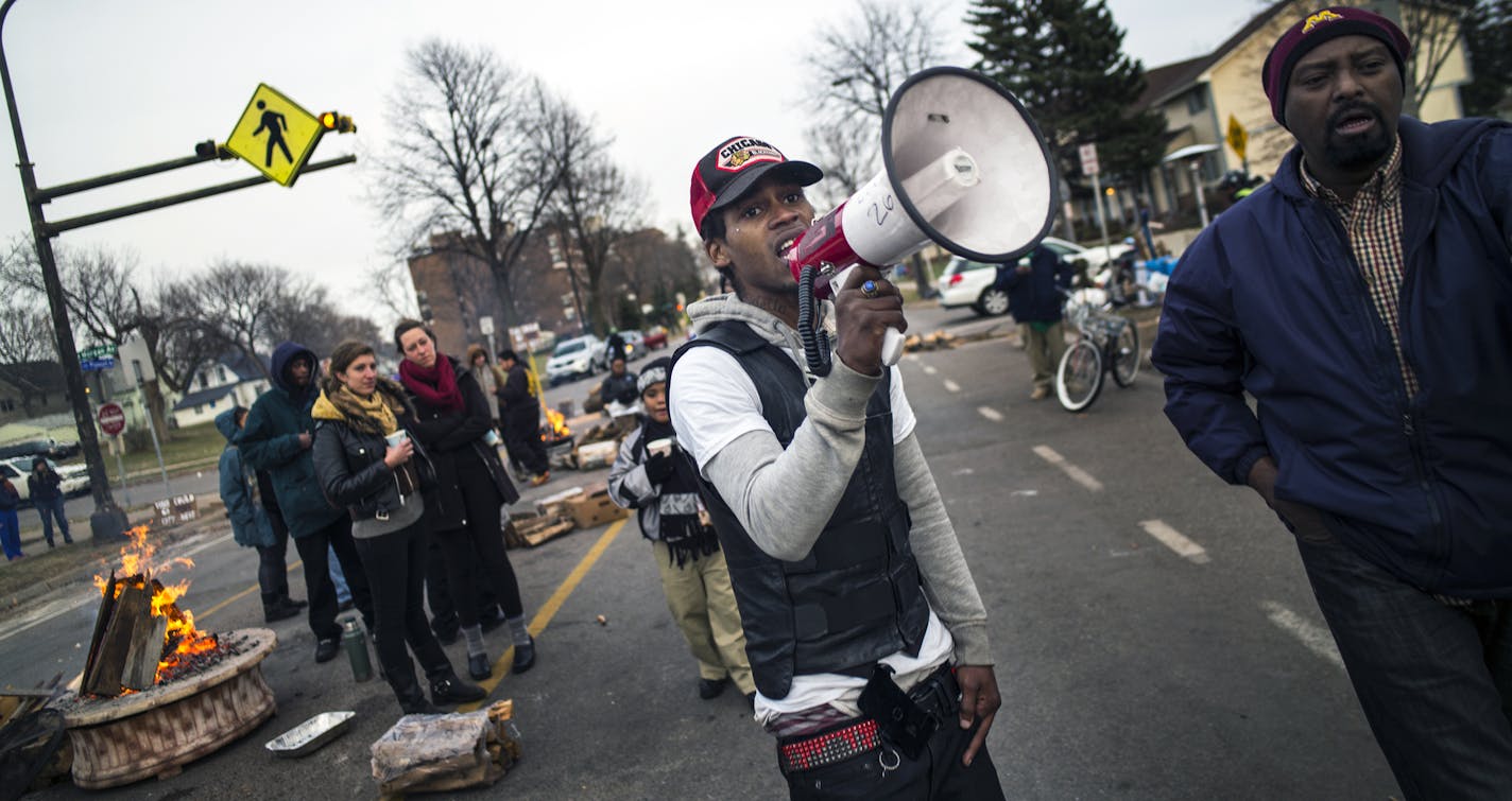 At the 4th Precinct in North Minneapolis, protesters including BLM activist Alexander Practice Clark continued to demand answers over the death of Jamar Clark who was shot and killed by police .]Richard Tsong-Taatarii/rtsong-taatarii@startribune.com