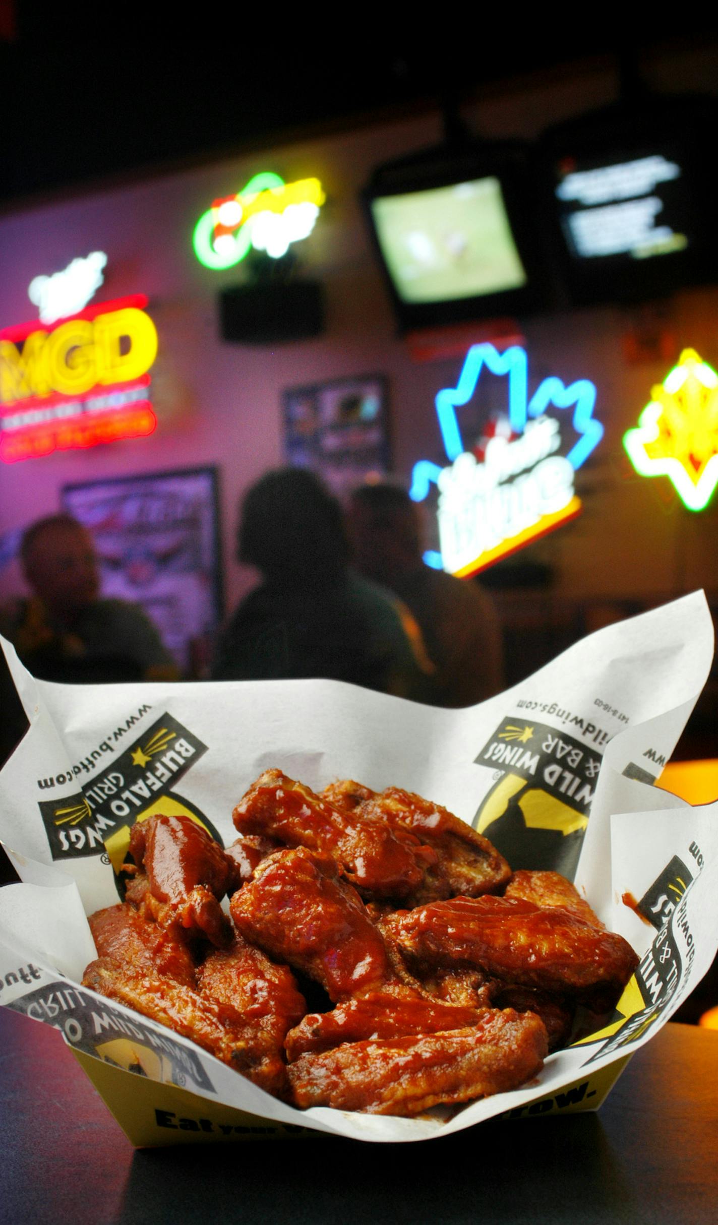 Roseville, MN, Friday, November 21, 2003 -- An order of Buffalo Wild Wings in the Har Mar Mall store in Roseville, MN. The company is set to price its IPO today. // Article ran Sat Nov 22, 2003, Star Tribune, page D1.