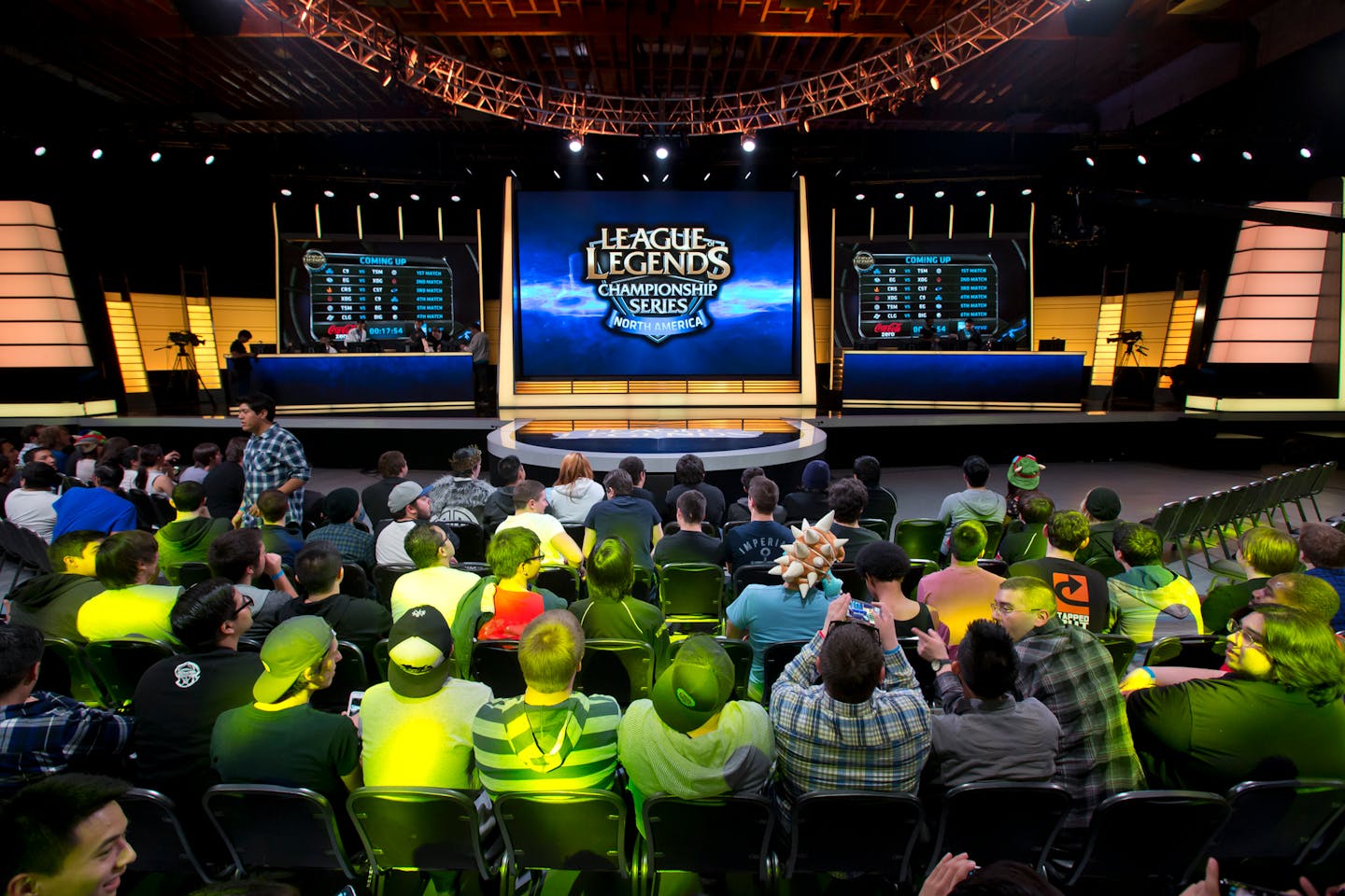 Spectators watch a League of Legends competition.