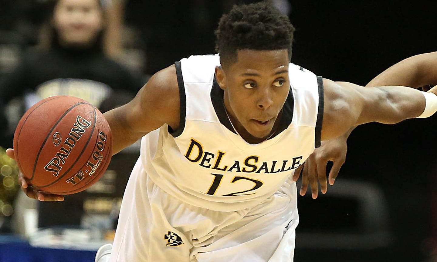 DeLaSalle&#xed;s Jarvis Johnson (left) took control of the ball against Mankato East&#xed;s CJ Ayers in the first half. ]JIM GEHRZ &#xef; james.gehrz@startribune.com / Minneapolis, MN / March 12, 2015 /12:00 PM &#xf1; BACKGROUND INFORMATION: The DeLaSalle High School Islanders played the Mankato East Cougars in the State Boys' Basketball Tournament Class 3A semifinals at the Target Center. ORG XMIT: MIN1503121320122976