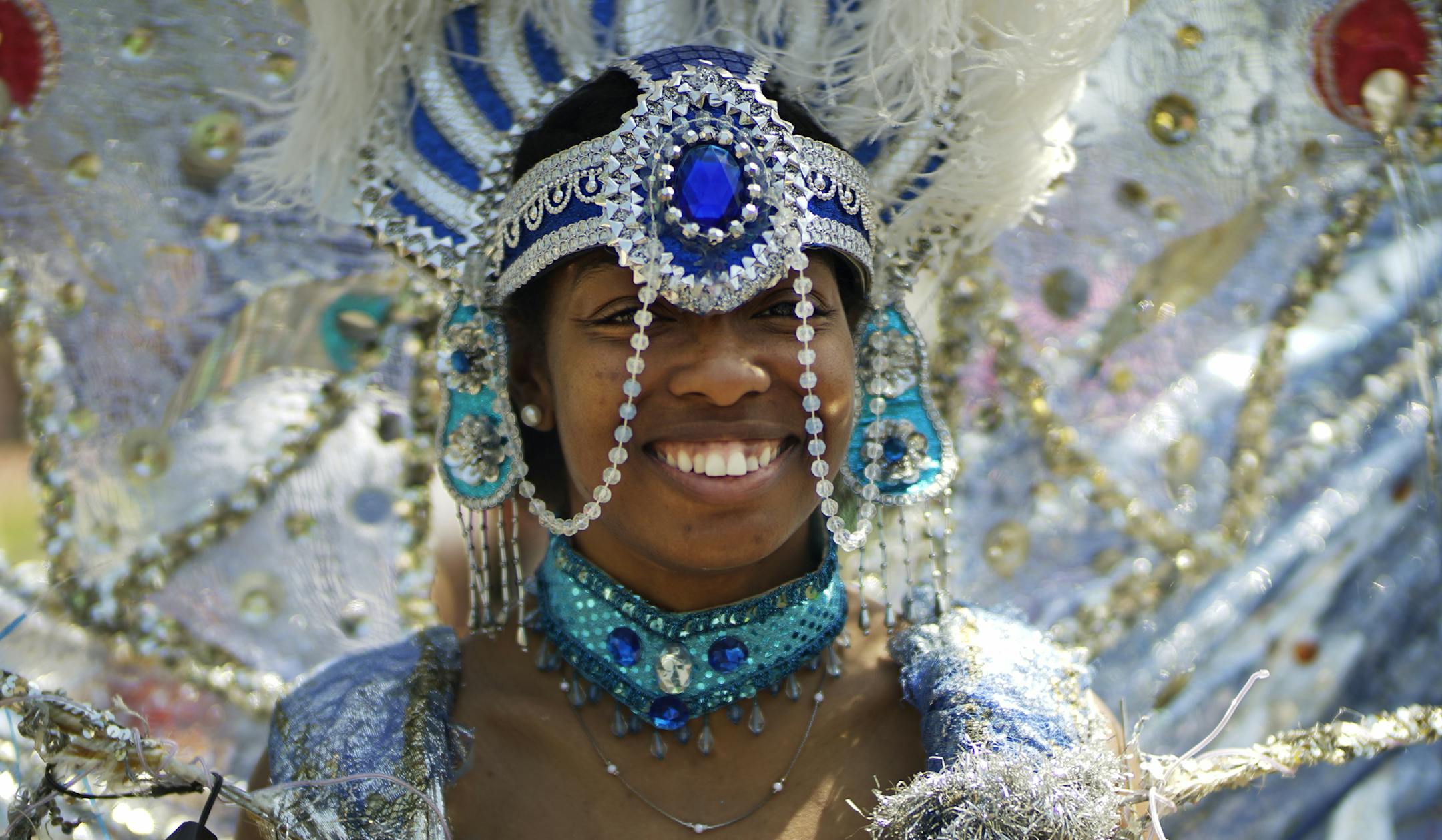 At the May Day Parade along Bloomington Ave, Christine Halstead was all smiles as she got ready with Carifest float group .] Richard Tsong-Taatarii/rtsong-taatarii@startribune.com