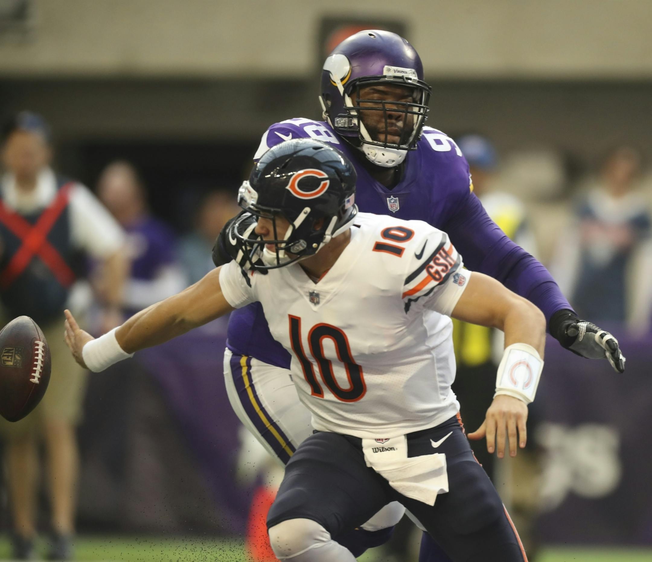 Minnesota Vikings defensive tackle Linval Joseph (98) forced Chicago Bears quarterback Mitchell Trubisky (10) to get rid of the ball in the endzone, for a Vikings safety in the second quarter.