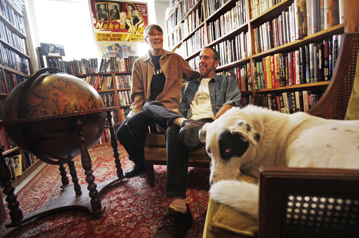 Pat Frovarp and Gary Shulze and their dog, Shamus, in Once Upon a Crime Bookstore in 2011.