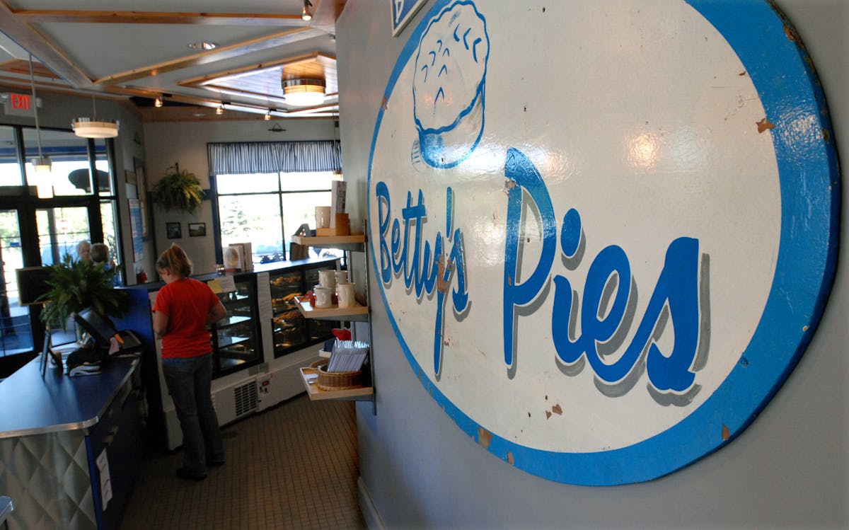 Behind the counter at Betty's Pies in Mahtomedi is a sign from the original Betty's Pies on the North Shore.