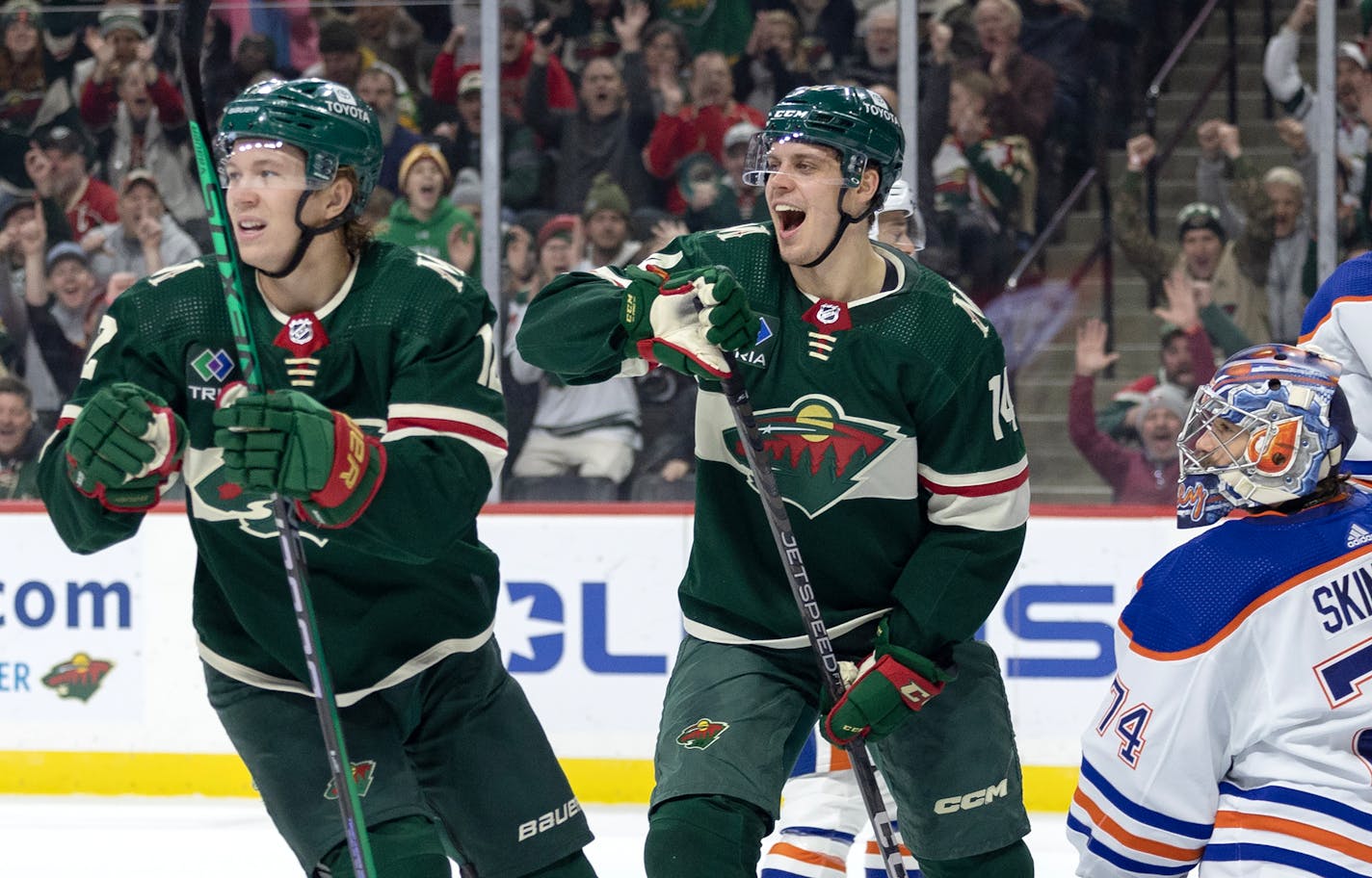 Matt Boldy (12) and Joel Eriksson Ek of the Minnesota Wild celebrate a goal in the first period Monday, December 12, 2022, at Xcel Energy Center in St. Paul, Minn. ] CARLOS GONZALEZ • carlos.gonzalez@startribune.com.