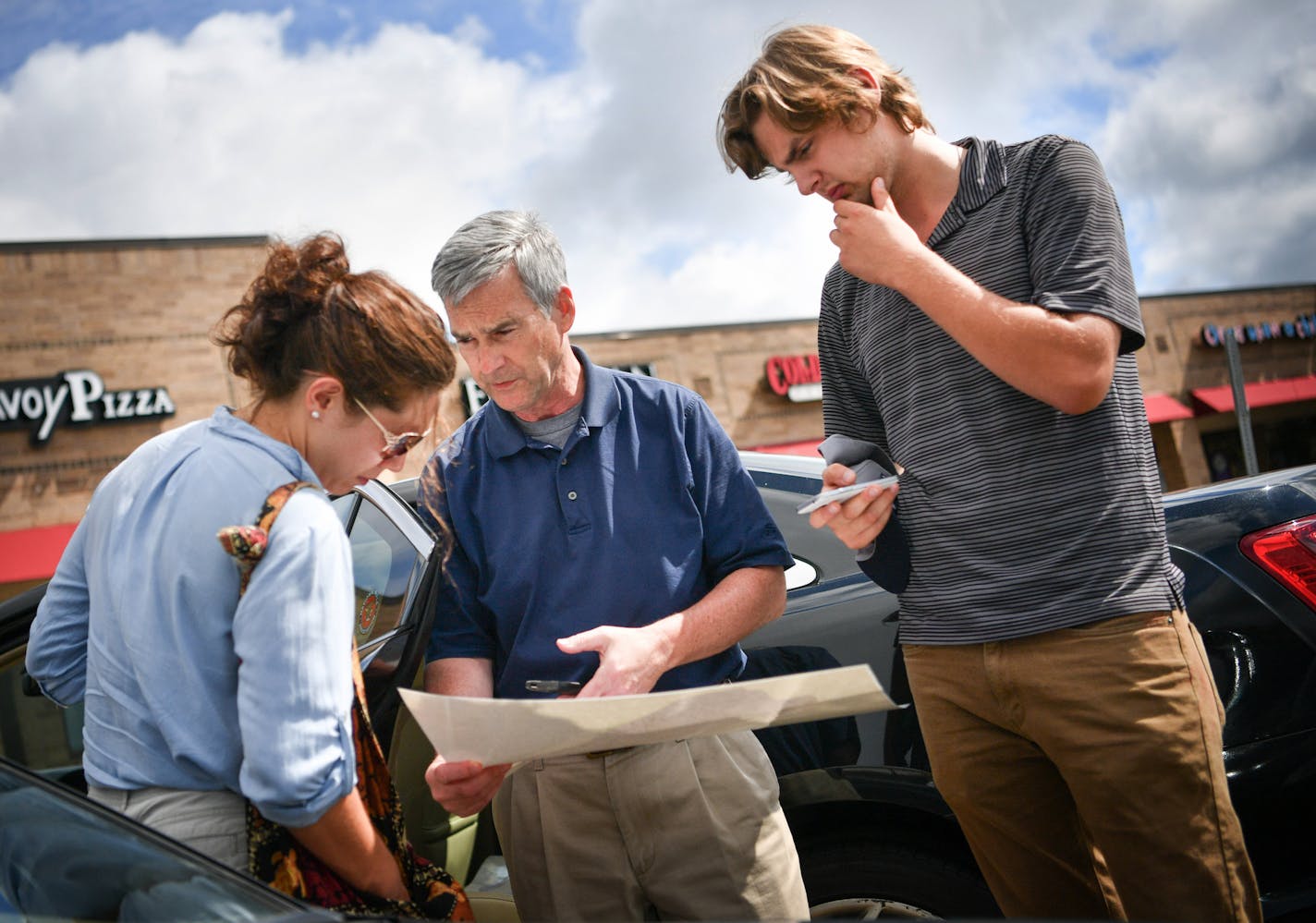 Sen. Minority Leader David Hann went over plans for the day's door knocking with intern Samantha Fletcher and staffer Tom Radke in Eden Prairie. ] GLEN STUBBE * gstubbe@startribune.com Friday, September 9, 2016 Sen. Minority Leader David Hann was door knocking in his district in Eden Prairie.