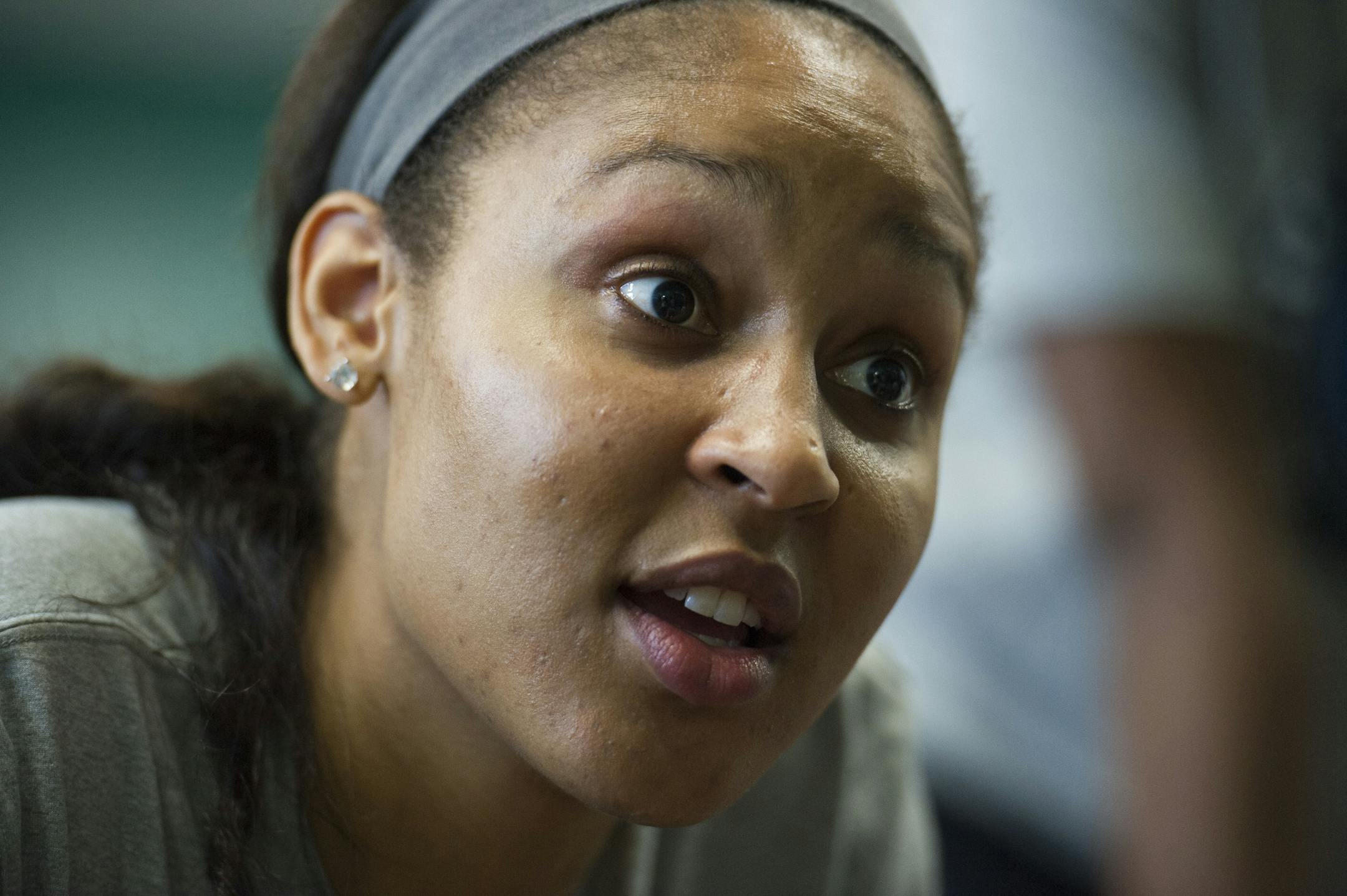 WNBA Champion Minnesota Lynx forward Maya Moore talks with a student after washing his feet at Payne Elementary School in Washington, Wednesday, June 6, 2018. Payne Elementary has the highest homeless student population in the district.