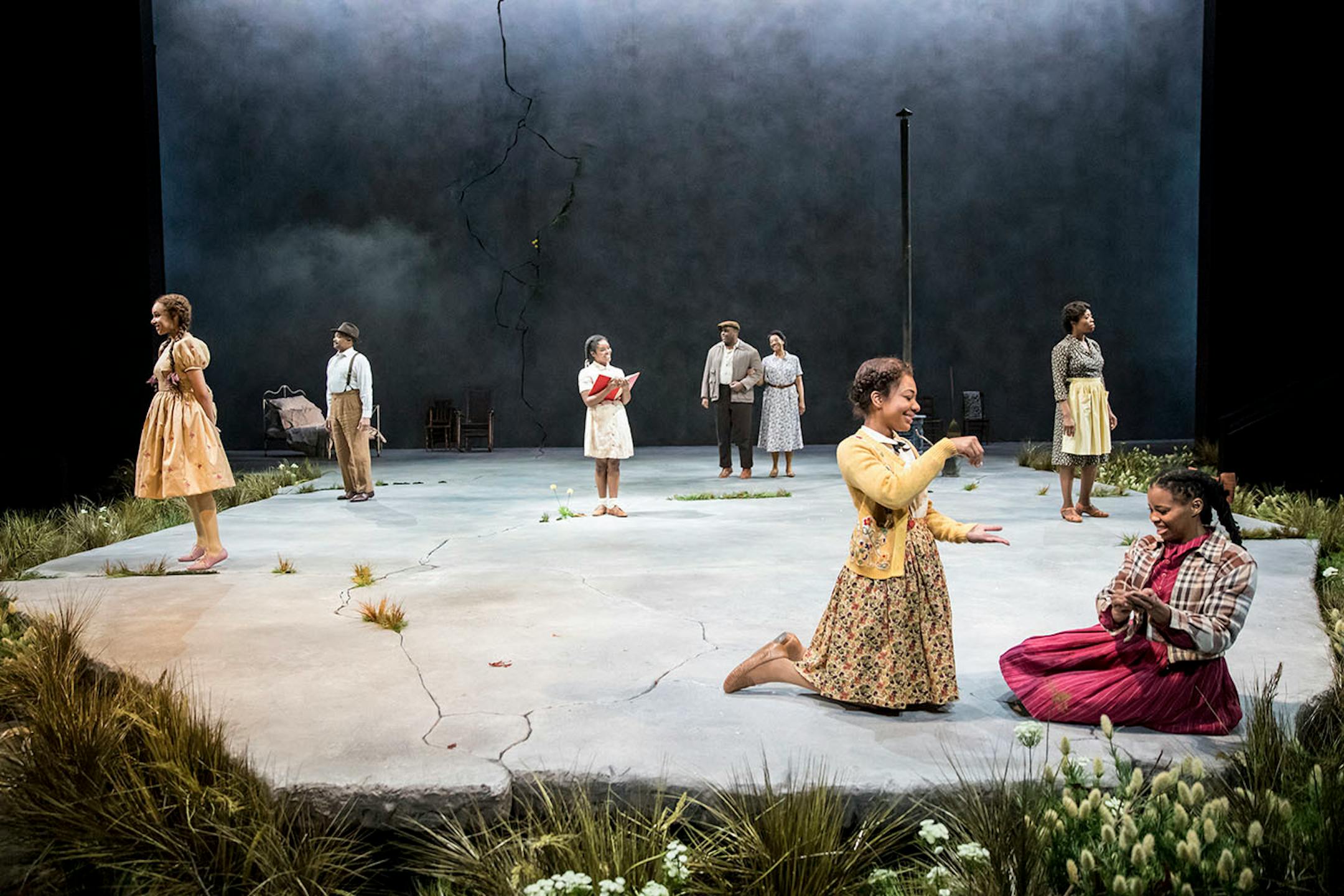 The cast of the Guthrie Theater's production of Toni Morrison's The Bluest Eye, adapted by Lydia R. Diamond and directed by Lileana Blain-Cruz. Scenic design by Matt Saunders, costume design by Montana Blanco and lighting design by Yi Zhao. Playing April 15 - May 21, 2017 on the Wurtele Thrust Stage at the Guthrie Theater, Minneapolis.