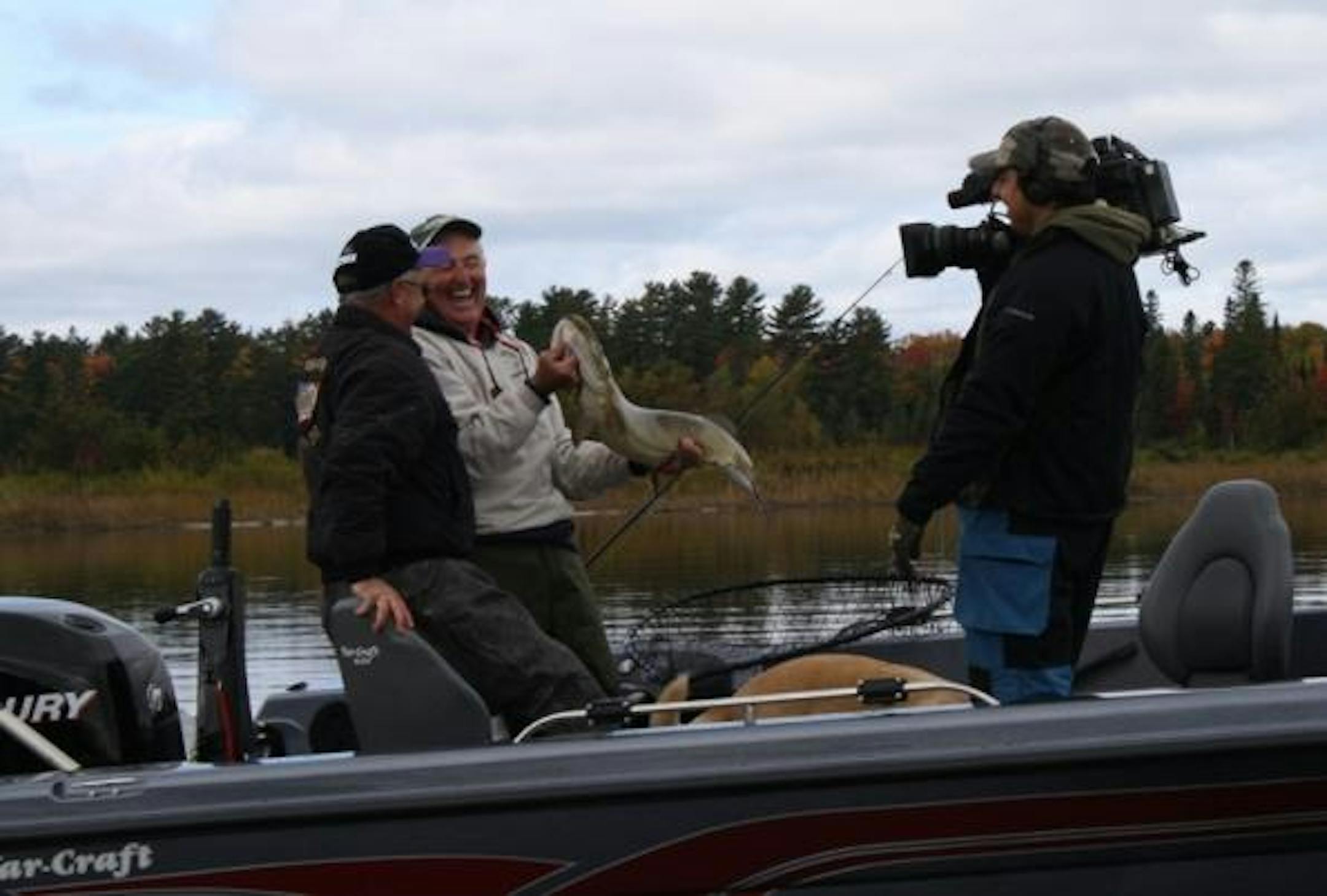 Joe Bucher and Coach Kip pose with a northern Wisconsin muskie caught on camera for the show.