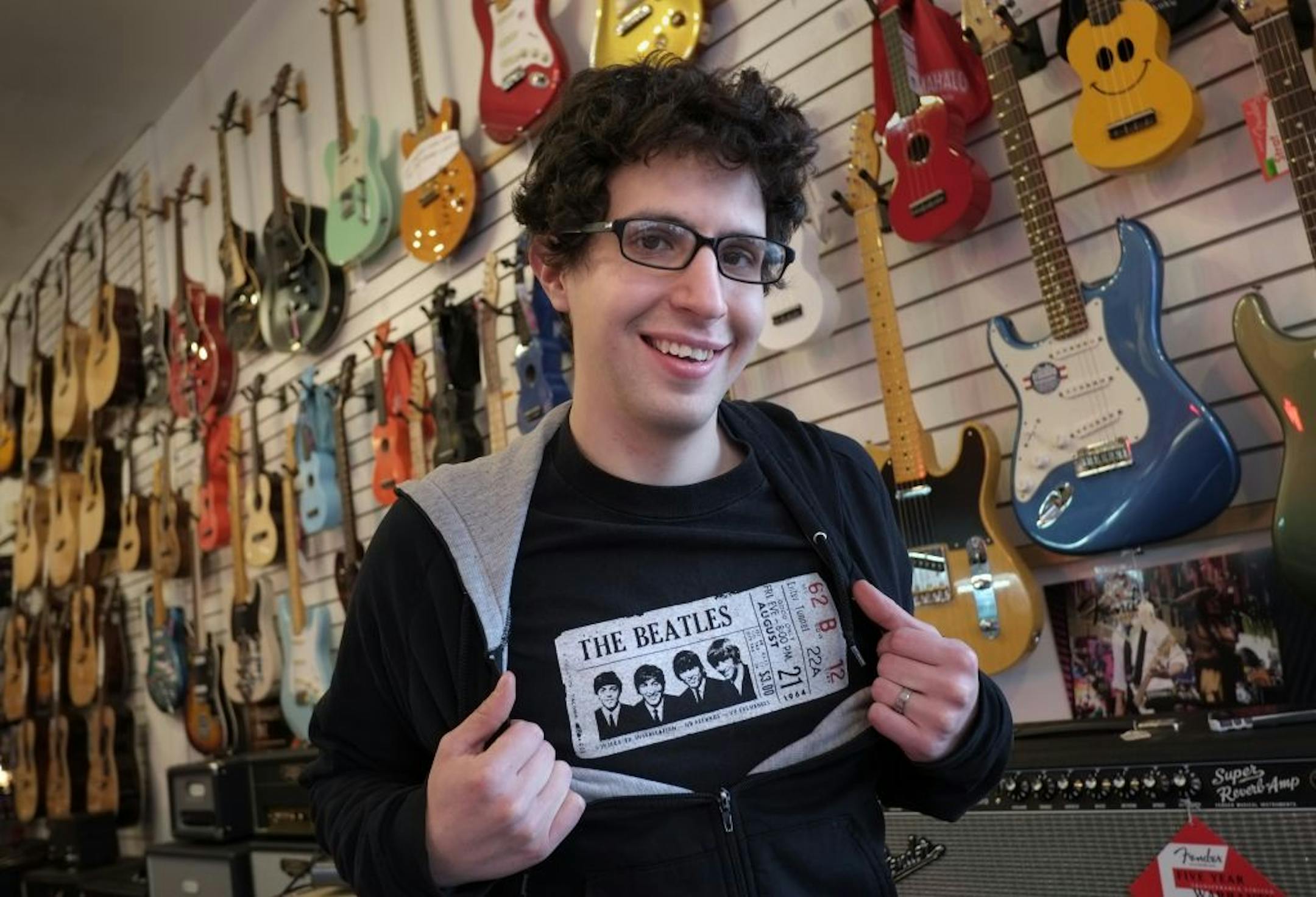 Bjorn Peterson at work at Twin Town Guitars in Minneapolis. Peterson said his Gen-X parents like Genesis and Phil Collins but he favors the sounds of the Beatles, Stones, Jimi Hendrix and Creedence Clearwater Revival.