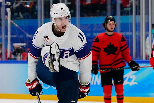 United States' Kenny Agostino celebrates after scoring a goal against Canada during a preliminary round men's hockey game at the 2022 Winter Olympics