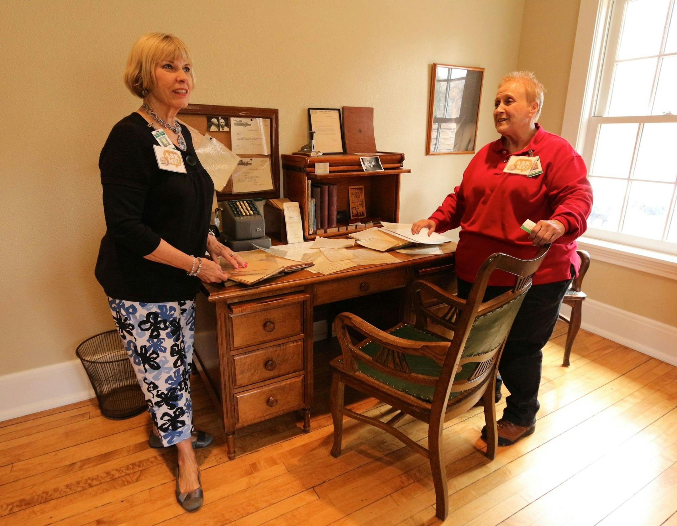 Sue Nau, left, and Linda Harder collected purchase receipts, time sheets and other documents to display in the old warden's house at Stillwater prison. They both retired as program directors from the prison.