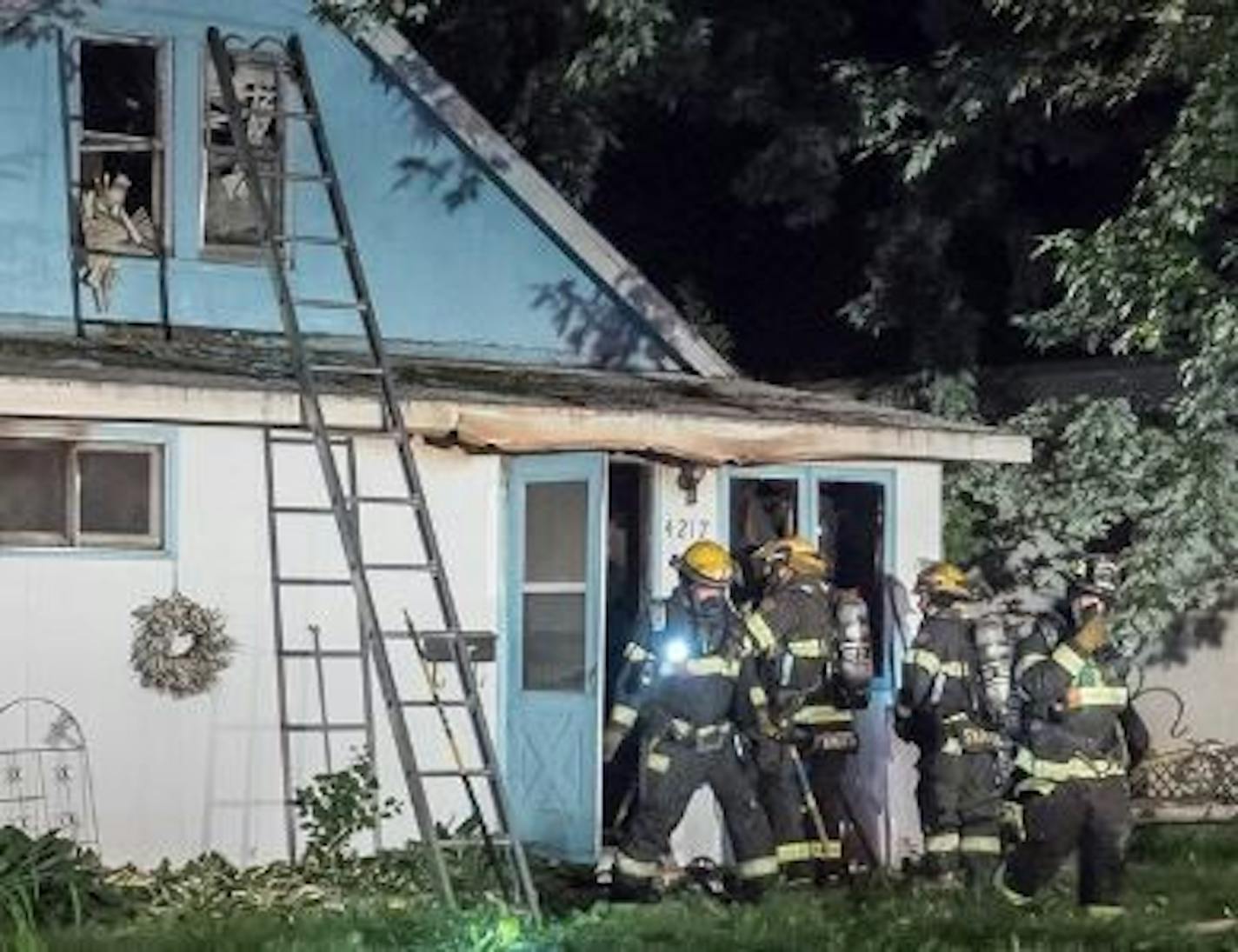 Firefighters tended to the aftermath of a fatal blaze early Sunday in Minneapolis.