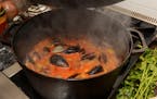 Steam rises from a pot of Italian Fish Soup as it cooks on a stove. (Johnny Crawford/Atlanta Journal-Constitution/MCT) ORG XMIT: 1132166